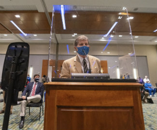 Professor Joe Hamilton at Metro Council podium 