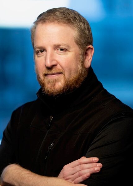 headshot of Seth Bordenstein with blue background