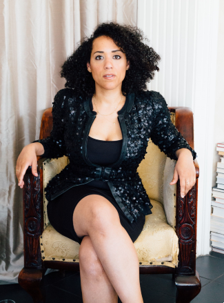 Caroline Randall Williams sitting in yellow chair