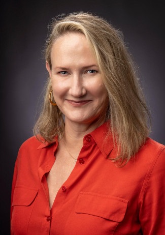 headshot of Bonnie Dow wearing orange shirt