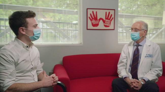 Student and Dr. William Schaffner discuss COVID-19 vaccine.