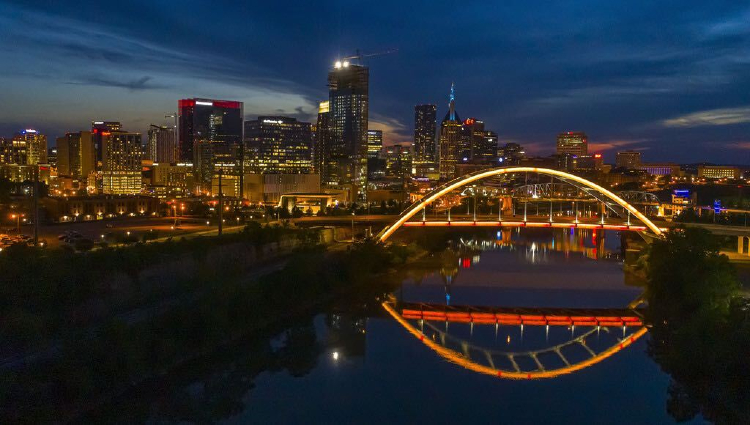 Nashville's Korean War Veterans Memorial Bridge lit in Vanderbilt colors in honor of the Class of 2021 on May 16, 2021.