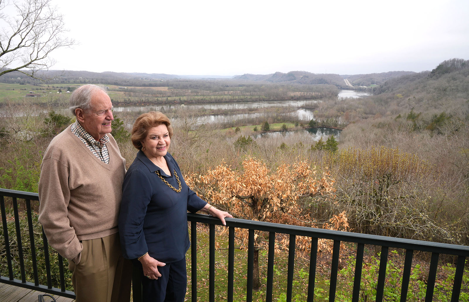 Bill and Jane Coble standing on a balcony overlooking their farm in Bells Bend in Davison County.