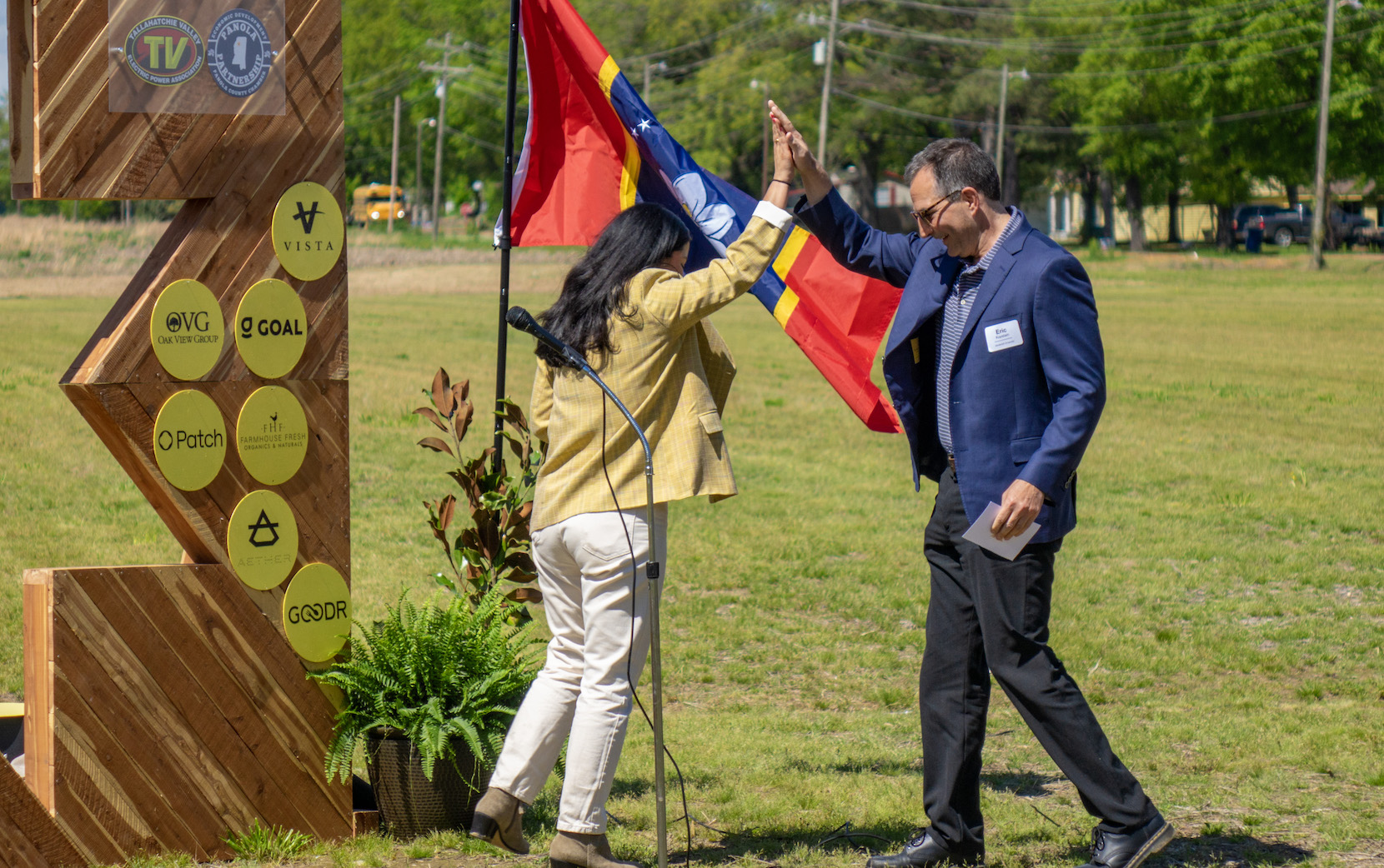 Clearloop CEO and co-founder Laura Zapata high fives Vice Chancellor Eric Kopstain during the Panola County solar farm groundbreaking ceremony