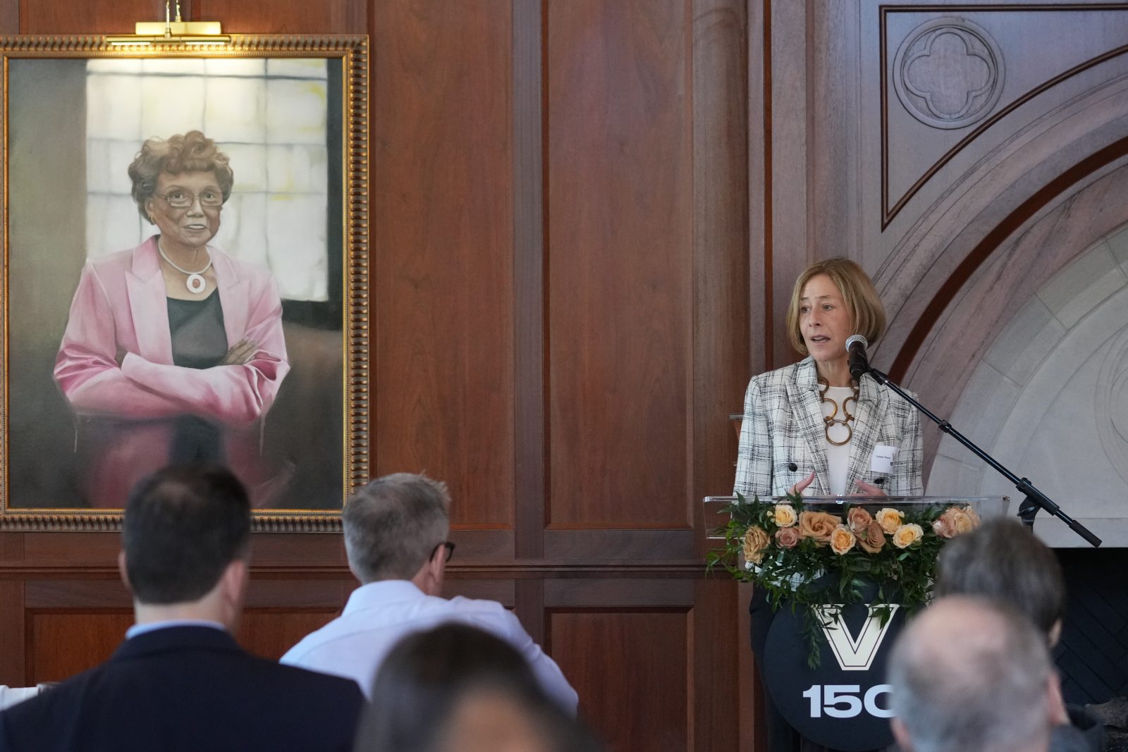 Provost and Vice Chancellor for Academic Affairs C. Cybele Raver (at podium) delivers remarks at the unveiling of the latest portraits in the Vanderbilt Trailblazers series, including that of Tommie Morton-Young. (Joe Howell)