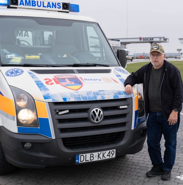 Quillen with an ambulance he delivered in Ukraine