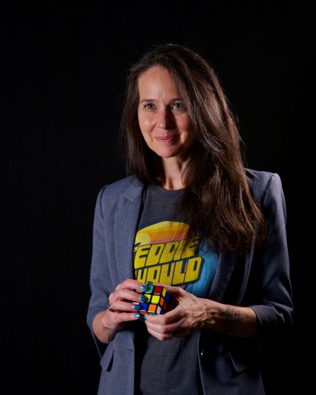 photograph of Jen Easterly holding Rubik's Cube