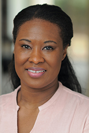 photograph of Kristyl Tift wearing pink blouse