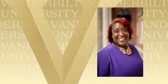 Photograph of Nicole Joseph on gold background with Vanderbilt V