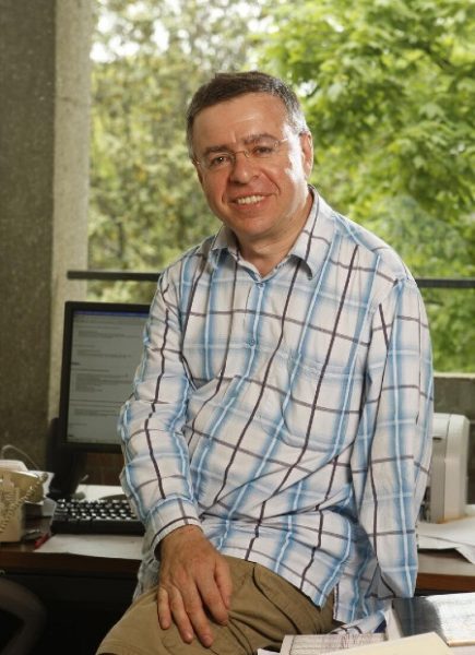 environmental photo of Mark Sapir in front of computer