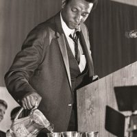 Stokely Carmichael, a militant leader of the Student Nonviolent Coordinating Committee, poured himself a glass of water before speaking during the Impact Symposium at Vanderbilt University. April 8, 1967. Photo by Dale Ernsberger. Courtesy of The Tennessean