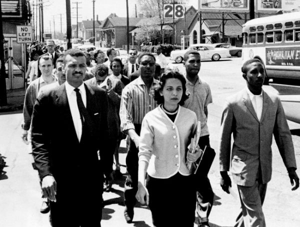 On April 19, 1960, the day of the Z. Alexander Looby bombing, as many as four thousand demonstrators marched down Jefferson Street toward city hall. In the first row are Rev. C. T. Vivian (left), Diane Nash of Fisk, and Bernard Lafayette of American Baptist Seminary. In the second row are Kenneth Frazier and Curtis Murphy of Tennessee A&I, and Rodney Powell of Meharry. Using his handkerchief in the third row is Rev. James Lawson. Photo by Jack Corn. Courtesy of The Tennessean
