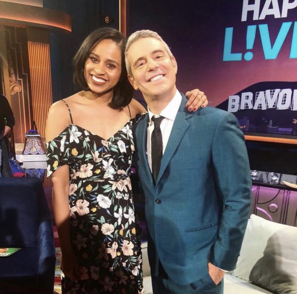 Imani Ellis, BA'12, with talk show host Andy Cohen on the set of his show