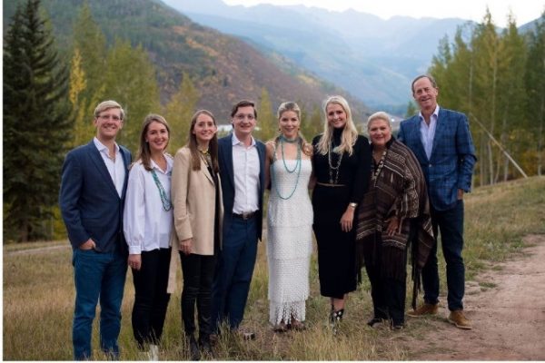 environmental photo of Suzanne Perot McGee and her family with mountains in the background