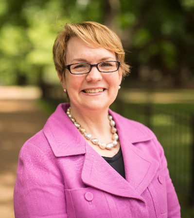 environmental photo of Vanessa Beasley wearing pink jacket 