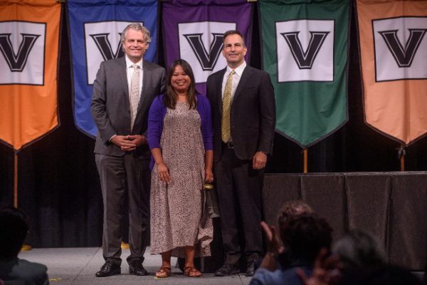 Chancellor Danieler Diermeier and Vice Chancellor for Administration Eric Kopstain present Commodore Award to Daravanh Weeks