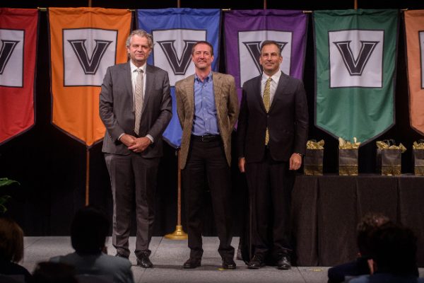 Chancellor Danieler Diermeier and Vice Chancellor for Administration Eric Kopstain present Mentorship Excellence Award to Trey Beasley