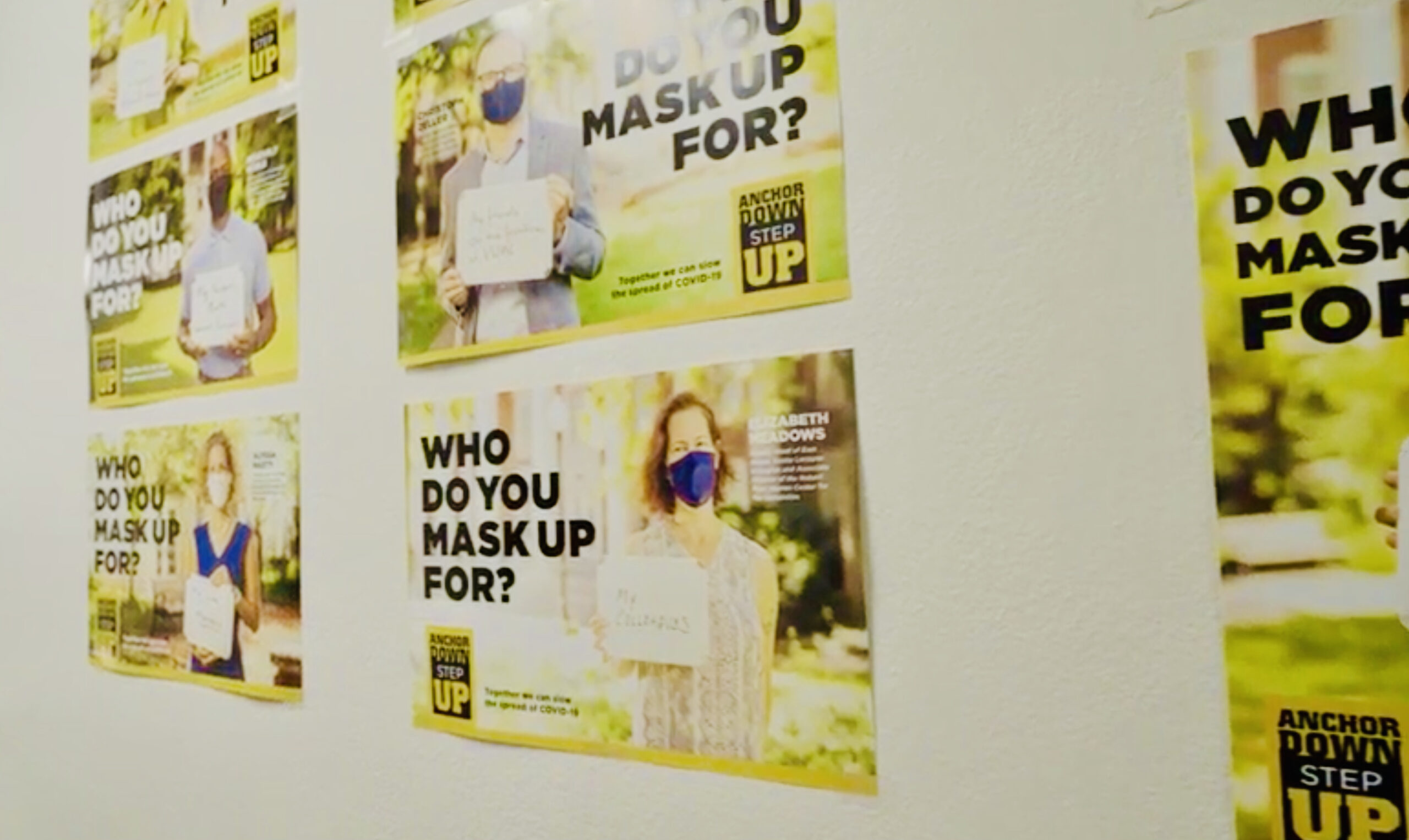 These posters highlight faculty and staff in the #AnchorDownMaskUp campaign.