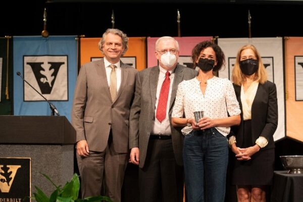 photograph of award winner Emily Lordi with Daniel Diermeier, Mark Maguson and Cybele Raver