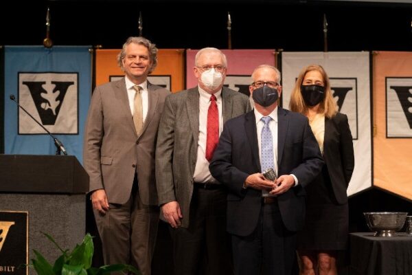 photograph of Daniel Diermeier, Mark Magnuson, Earl Sutherland Award winner John McLean and Cybele Raver