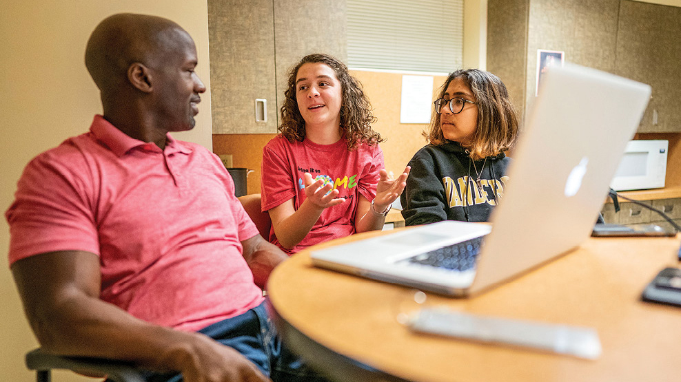 Noble (left) meets with Stambaugh’s resident advisers, junior Clara Leonard (left) and sophomore Navya Thakkar, after another successful StamSweets gathering.