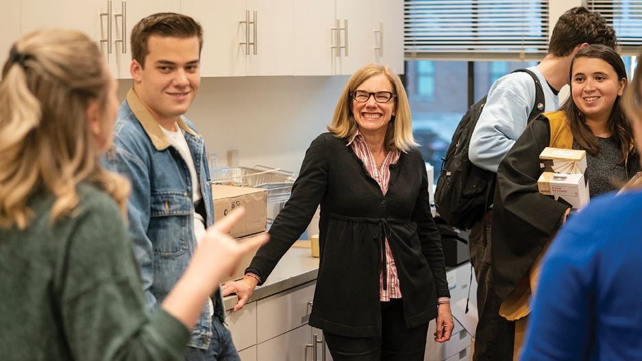 Igo (center) meets weekly with the E. Bronson Ingram College Council to conceive and plan events. Students, like sophomore representative Carlos Ahrens (left) and junior representative Sara Van Tuerenhout (right), gain valuable leadership experience through a close working relationship with the faculty head and the residential college staff.