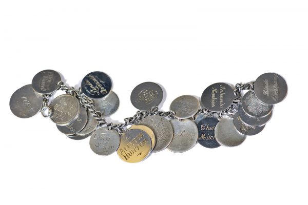 The Lady of the Bracelet charm bracelet, each charm has the name of the winner for years from the 1930 to 1970s when it was last given. In University Archives