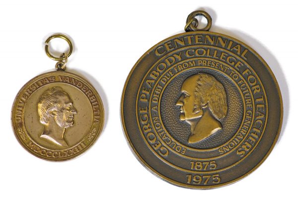 Medalions from University Archives showing Cornelius Vanderbilt's head, one from Vanderbilt's centennial