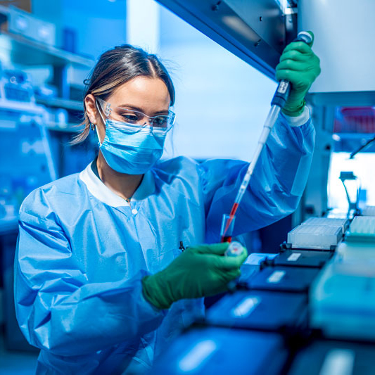 researcher filling a test tube