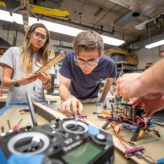 students working on electronics 