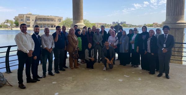 group of people standing outside for group photo