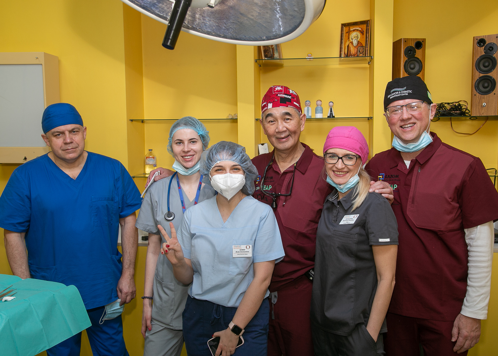 Following surgery, members of the surgical team in the Ukraine pose for a photo.