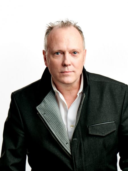 Head shot of Bryan Deaner in a black jacket and white shirt