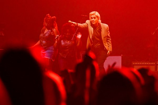 Brandi Carlile on stage pointing to the crowd