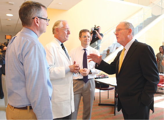 Photo of Lamar Alexander with researchers