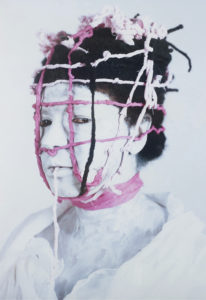 a photo of Campos-Pons in white makeup with pink string wrapped around her head