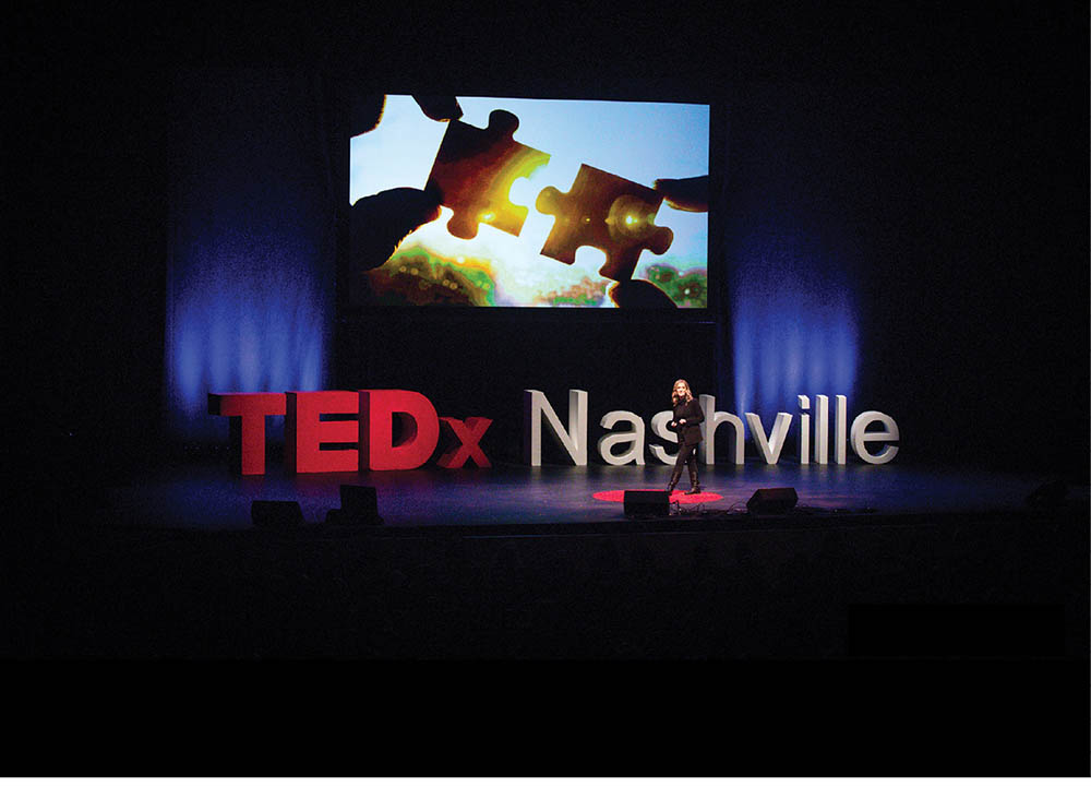 photo of Kelly Goldsmith on stage at a TEDx Nashville event