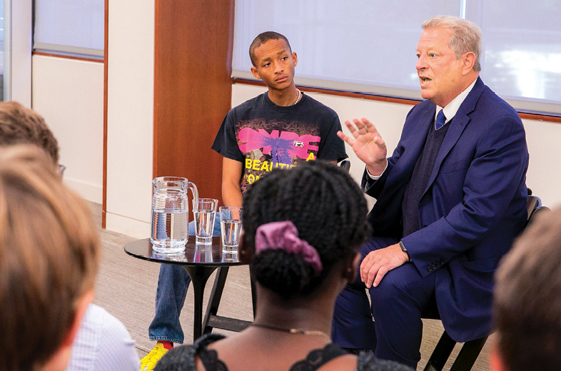 photo of Al Gore and Jaden Smith speaking to a group of students
