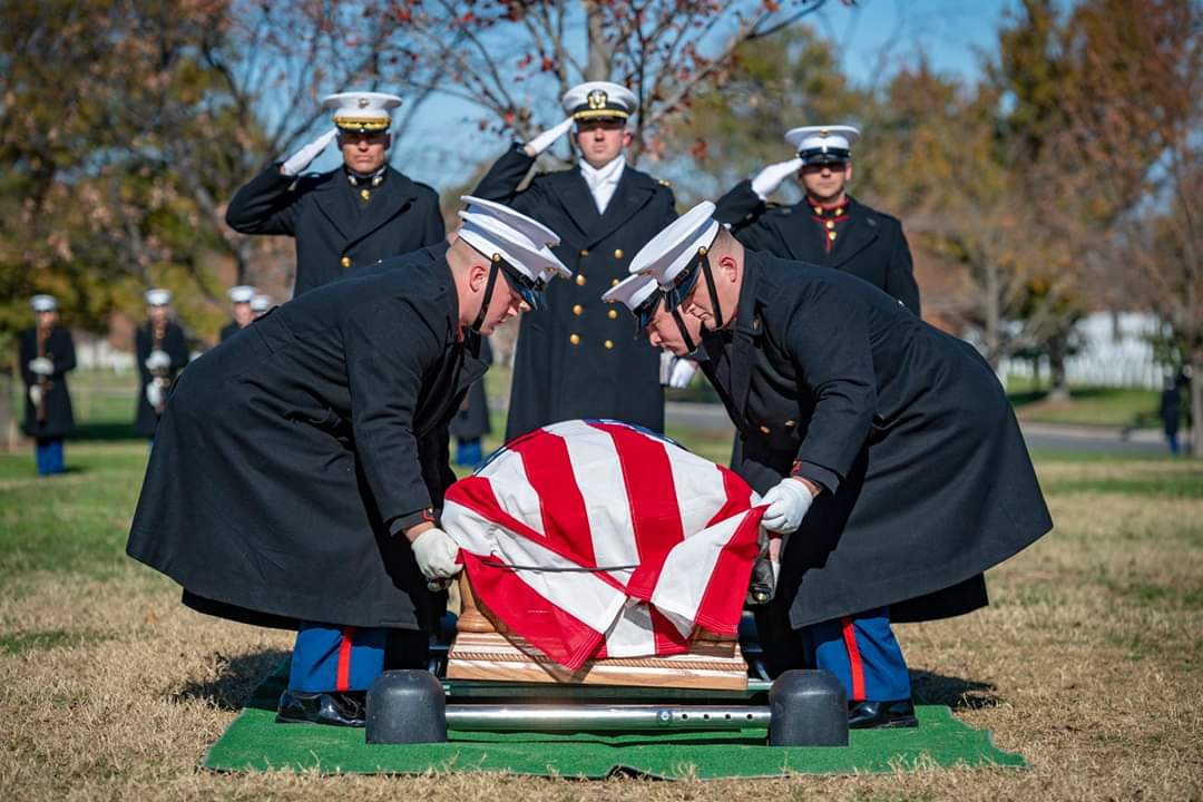 George Schmidt, center, leads a funeral ceremony at Arlington National Cemetery as a military chaplain.
