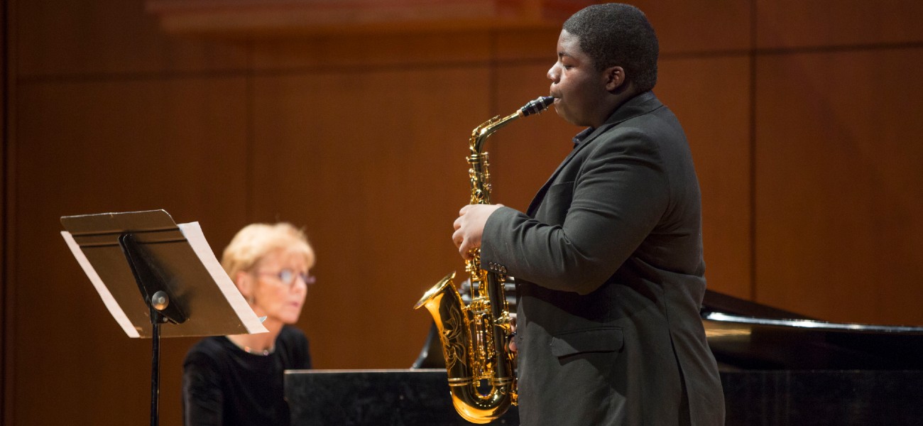 student playing saxophone