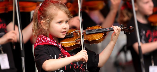 Child playing the fiddle 