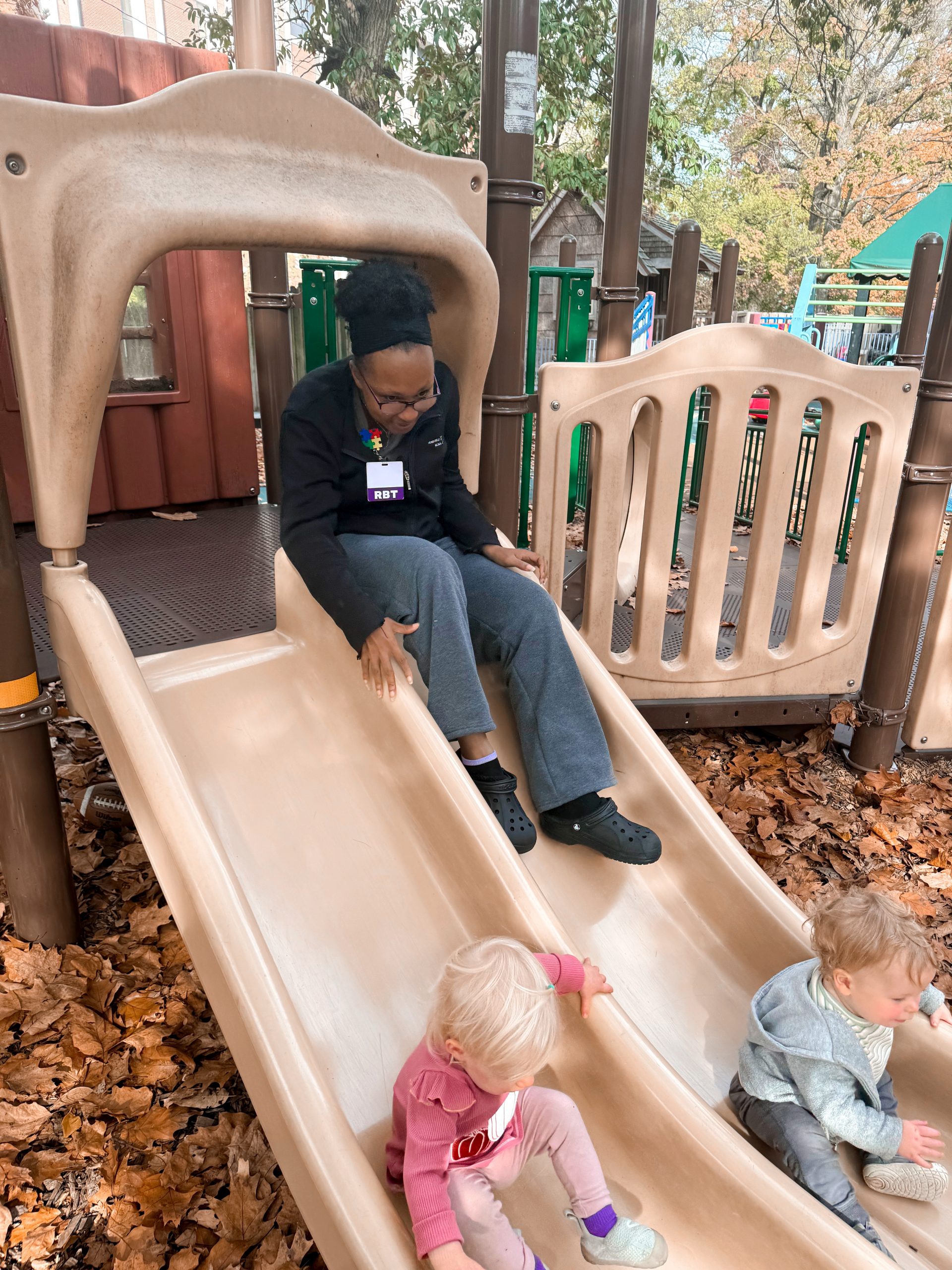 The Susan Gray School - adult/kids on a slide