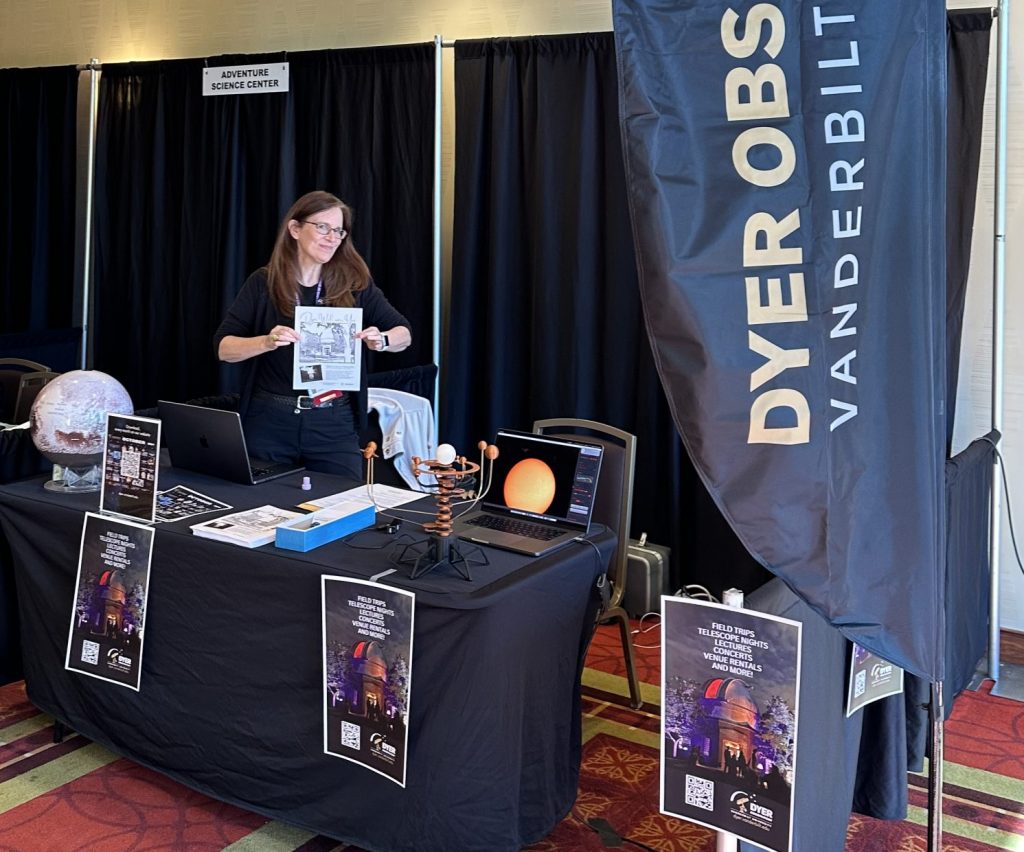 A Dyer staffmember standing in an exhibition booth