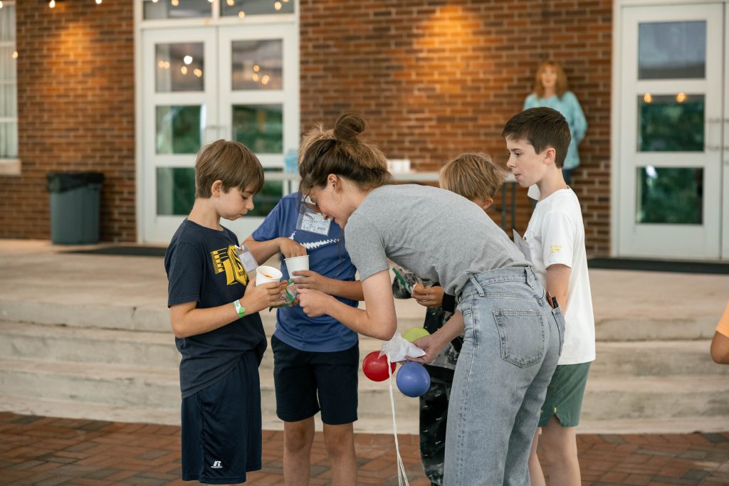Students and staff eagerly determine if the egg-onaut in the capsule survived the journey.