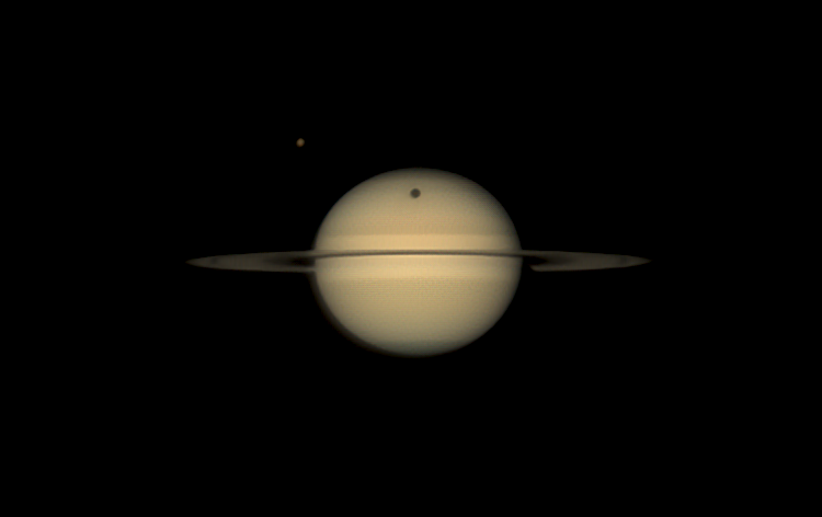 In the early morning hours of August 19, 2025, Saturn's largest moon Titan cast a shadow on Saturn's globe.  This view is a stacked image obtained by Dyer Observatory's Seyfert Telescope. Credit: Billy Teets