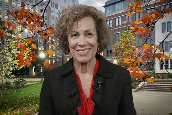 Dean Pamela Jeffries in front of the School of Nursing Building in the autumn