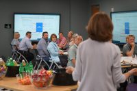 group of people at a conference listening to a talk