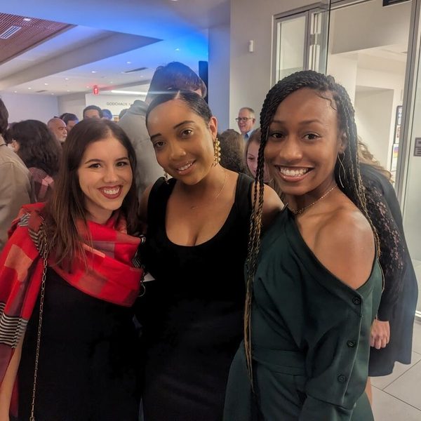 three people smiling