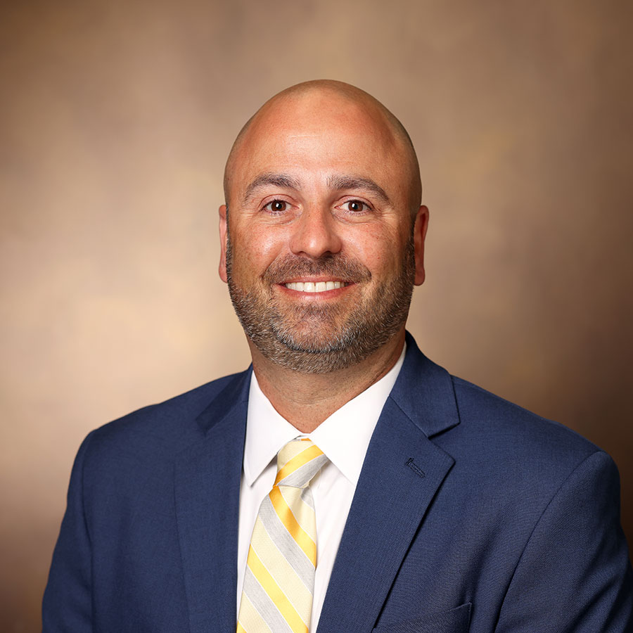 smiling Brent Dunworth in suit and tie