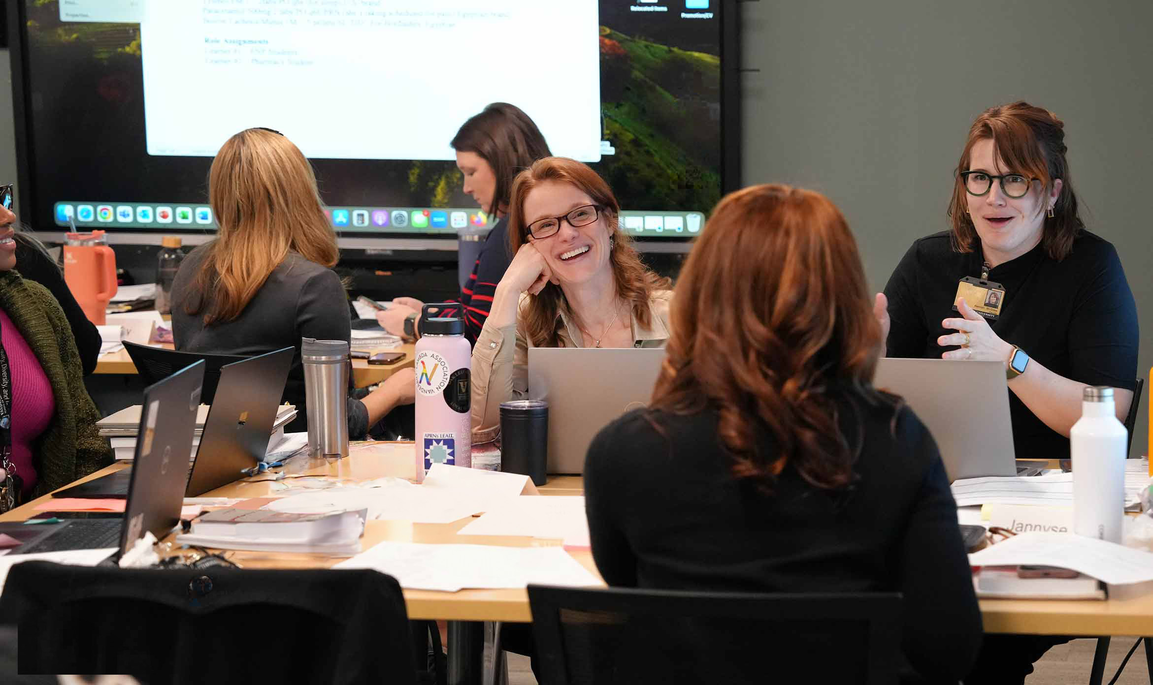 faculty and students in a classroom setting